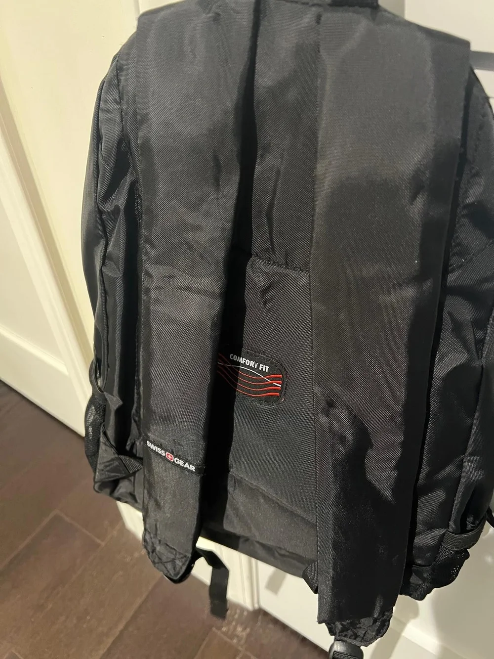 Jansport Black Sling Backpack with Front Zip Pocket